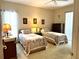 Spacious bedroom with two twin beds, ample closet space, and a ceiling fan at 2277 Calvert Ct, Clermont, FL 34711