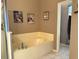 Large bathtub and separate shower in this well-lit bathroom at 2277 Calvert Ct, Clermont, FL 34711