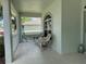 Charming front porch with wicker furniture, perfect for relaxing outdoors at 2277 Calvert Ct, Clermont, FL 34711