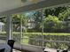Peaceful screened patio offering backyard views and plenty of natural light at 2277 Calvert Ct, Clermont, FL 34711