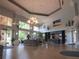 Elegant lobby featuring a chandelier and artwork at 2277 Calvert Ct, Clermont, FL 34711