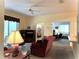 Open living room showcasing access to other rooms and a view to the backyard at 2277 Calvert Ct, Clermont, FL 34711