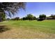 Landscaped golf course with mature trees and homes at 2277 Calvert Ct, Clermont, FL 34711