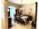 Elegant dining room featuring a formal table set for six at 2277 Calvert Ct, Clermont, FL 34711