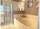 Relaxing bathroom with a large garden tub, shower, and plenty of natural light at 2277 Calvert Ct, Clermont, FL 34711