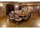 Elegant wine cellar with large wood table and seating for entertaining at 15607 Vetta Dr, Montverde, FL 34756