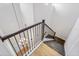 Elegant staircase with dark wood railings and hardwood floors at 15607 Vetta Dr, Montverde, FL 34756