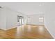 Light and airy living room with hardwood floors and sliding doors at 15607 Vetta Dr, Montverde, FL 34756