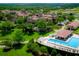 Aerial view showing community pool and villas at 15607 Vetta Dr, Montverde, FL 34756