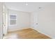 Light and airy bedroom featuring wood flooring and an ensuite bathroom at 15607 Vetta Dr, Montverde, FL 34756