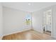 Bright bedroom with wood floors and access to a private bathroom at 15607 Vetta Dr, Montverde, FL 34756