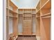 Large walk-in closet with ample shelving and hanging space at 9323 San Jose Blvd, Howey In The Hills, FL 34737