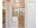 Glass-enclosed shower with tiled walls at 9323 San Jose Blvd, Howey In The Hills, FL 34737