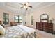 Main bedroom with king bed, and access to private bathroom at 9323 San Jose Blvd, Howey In The Hills, FL 34737