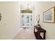 Elegant entryway, featuring a beautiful stained-glass door and tile flooring at 9323 San Jose Blvd, Howey In The Hills, FL 34737
