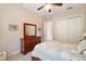 Bedroom with queen bed and dresser, plus a door to the bathroom at 9323 San Jose Blvd, Howey In The Hills, FL 34737