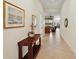 Bright entryway with tile floors, decorative console table, and views into the living area at 9323 San Jose Blvd, Howey In The Hills, FL 34737