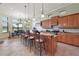Gourmet kitchen boasts granite countertops, custom cabinetry, and breakfast bar at 9323 San Jose Blvd, Howey In The Hills, FL 34737