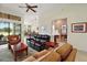 Relaxing living room with views into kitchen and backyard, offering an open floor plan at 9323 San Jose Blvd, Howey In The Hills, FL 34737
