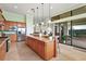 Large kitchen with granite island, stainless steel appliances, and view of backyard at 9323 San Jose Blvd, Howey In The Hills, FL 34737