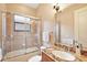 Bathroom with tub, shower, and granite vanity at 9323 San Jose Blvd, Howey In The Hills, FL 34737