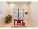 Bright home office with wood desk and built-in shelves at 9323 San Jose Blvd, Howey In The Hills, FL 34737