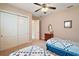 Bedroom with twin beds and ceiling fan at 9323 San Jose Blvd, Howey In The Hills, FL 34737