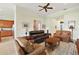 Living area with multiple seating options, a view of the kitchen, and a relaxing atmosphere at 9323 San Jose Blvd, Howey In The Hills, FL 34737