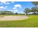 Sand trap and green with trees and bridge views at 9323 San Jose Blvd, Howey In The Hills, FL 34737
