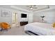 Spacious bedroom with ensuite bathroom access and ceiling fan at 74 Polermo Ave, Saint Cloud, FL 34771