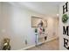 Bright and airy entryway with a console table, mirror, and decor at 74 Polermo Ave, Saint Cloud, FL 34771