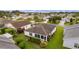 Community overview showcasing house and neighborhood at 2403 Carriage Hill Way, The Villages, FL 32162