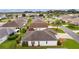 Community overview showcasing house and neighborhood at 2403 Carriage Hill Way, The Villages, FL 32162