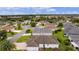 An aerial view showcasing a home's exterior and community landscape at 2403 Carriage Hill Way, The Villages, FL 32162