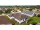 Aerial view of a house and surrounding neighborhood at 2403 Carriage Hill Way, The Villages, FL 32162