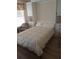 Comfortable bedroom with built-in cabinets and window coverings at 2403 Carriage Hill Way, The Villages, FL 32162