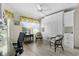 Home office with built-in cabinets and comfortable seating at 2403 Carriage Hill Way, The Villages, FL 32162