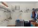 Large walk-in closet with wire shelving and ample hanging space at 2403 Carriage Hill Way, The Villages, FL 32162