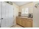 Functional laundry area with countertop space and ample cabinetry at 640 San Pedro Dr, The Villages, FL 32159