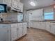 Well-equipped kitchen featuring ample counter space and white cabinets at 505 Torres Pl, The Villages, FL 32159