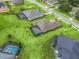 Aerial view of house and backyard with pool at 5159 Greens Dr, Lady Lake, FL 32159