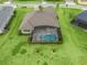 Aerial view showcasing house and pool at 5159 Greens Dr, Lady Lake, FL 32159