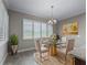 Bright breakfast nook with table and chairs, offering a view to the outdoors at 5159 Greens Dr, Lady Lake, FL 32159