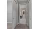 Hallway with access to laundry room and bathroom at 5159 Greens Dr, Lady Lake, FL 32159