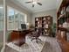 Spacious home office with built-in shelves and a large desk at 5159 Greens Dr, Lady Lake, FL 32159