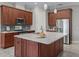 Modern kitchen with stainless steel appliances and large kitchen island at 5159 Greens Dr, Lady Lake, FL 32159