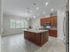 Kitchen with a large island and granite countertops at 5159 Greens Dr, Lady Lake, FL 32159