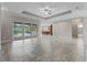 Open living area with tile floors and sliding doors to the pool at 5159 Greens Dr, Lady Lake, FL 32159