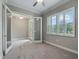 Home office with French doors opening to the entryway at 5159 Greens Dr, Lady Lake, FL 32159