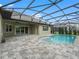 Relaxing pool area with screened enclosure and patio at 5159 Greens Dr, Lady Lake, FL 32159
